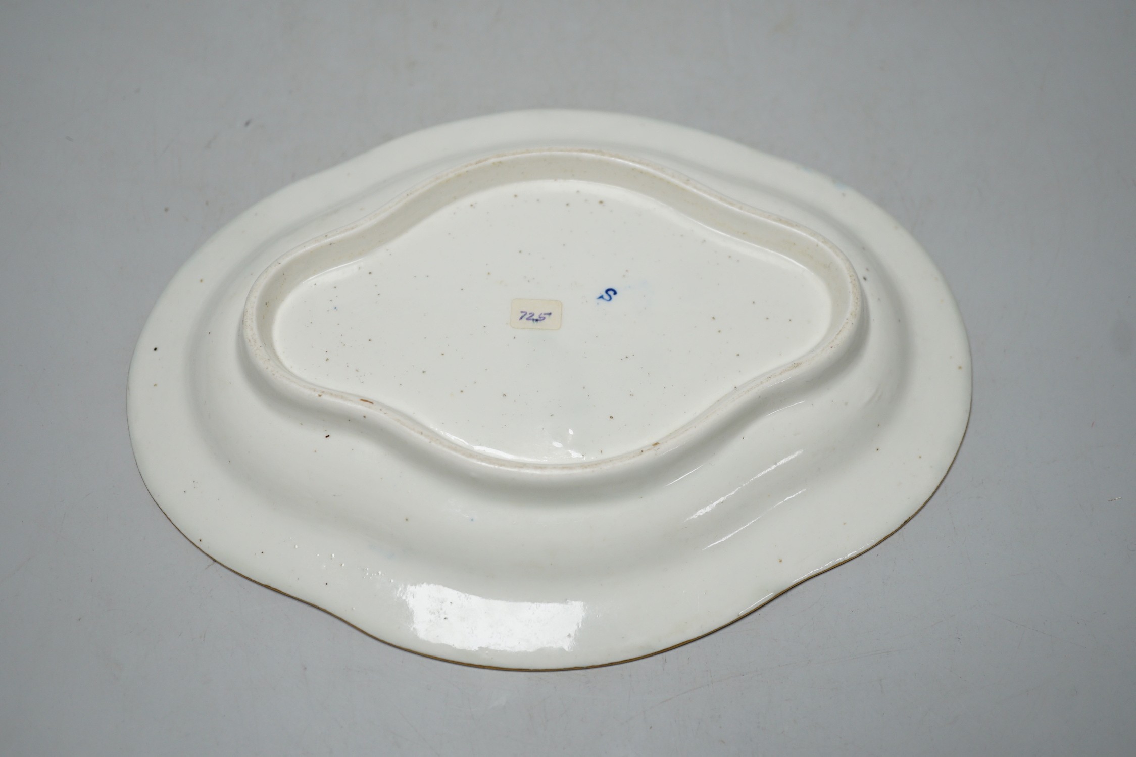 An 18th century Caughley tureen cover and stand with blue and gilt decoration, stand mis-fired to border, S mark to stand and base. 15cm wide